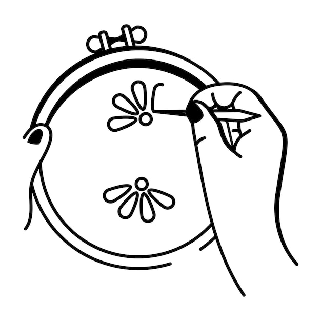 Рука вышивает узор